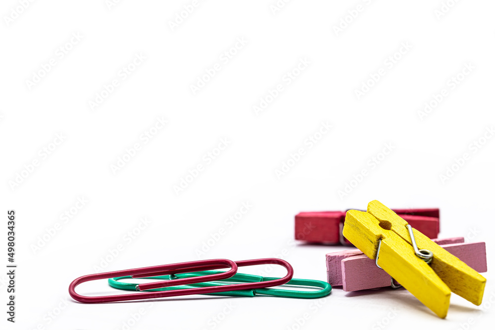 colorful metal paper clips and wooden clothespins colorful metal paper clips and wooden clothespins