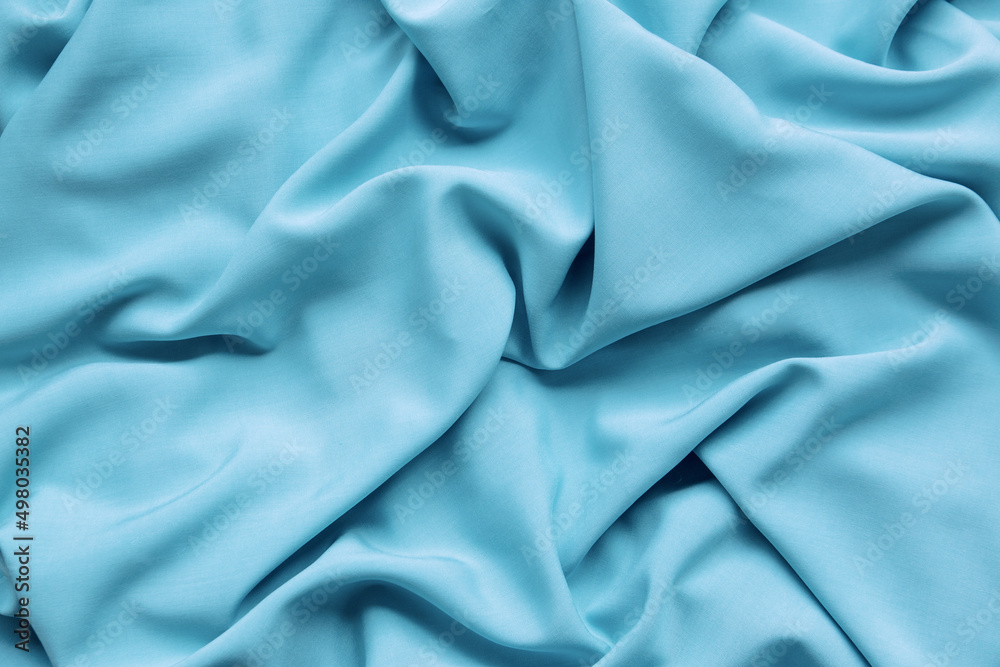 Background from turquoise fabric. The texture of the fabric.