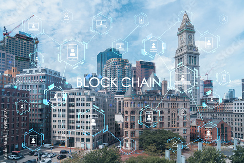 Panoramic picturesque financial downtown city view of Boston from Harbour area at day time  Massachusetts. technological and educational center. Blockchain and cryptography concept  hologram