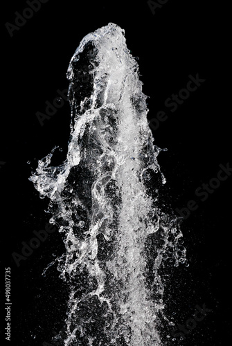 Water splash isolated over black background, vertical orientation