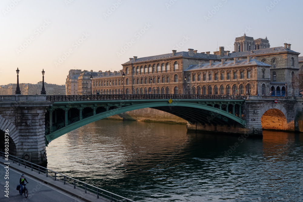 Cycling on the Seine river quay near the pont de Notre-Dame bridge