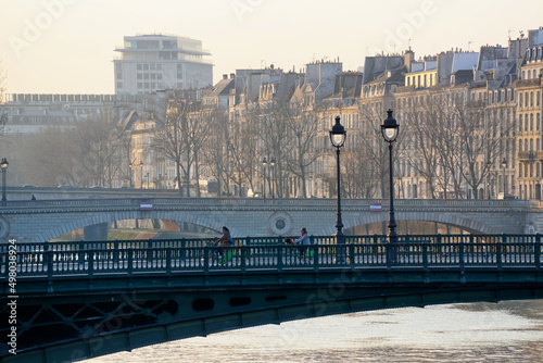 Cycling on the Seine river quay near the pont de Notre-Dame bridge © hassan bensliman