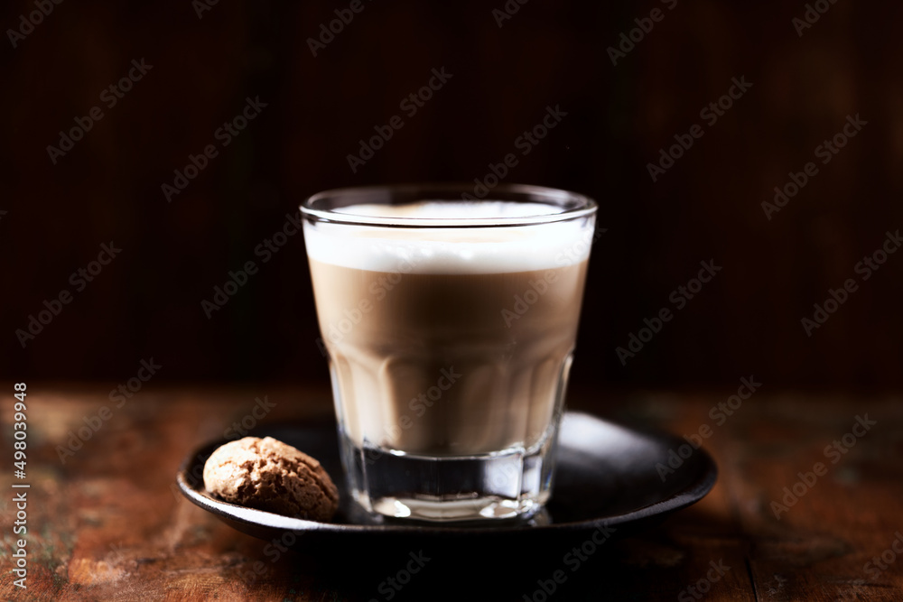 Coffee with milk on dark wooden background. Soft focus. Close up. Copy space. Coffee with milk on dark wooden background. Soft focus. Close up. Copy space.
