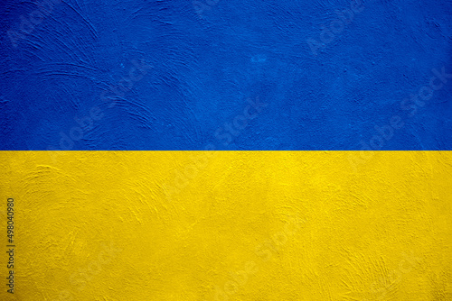 Flag of Ukraine on old grunge wall in background