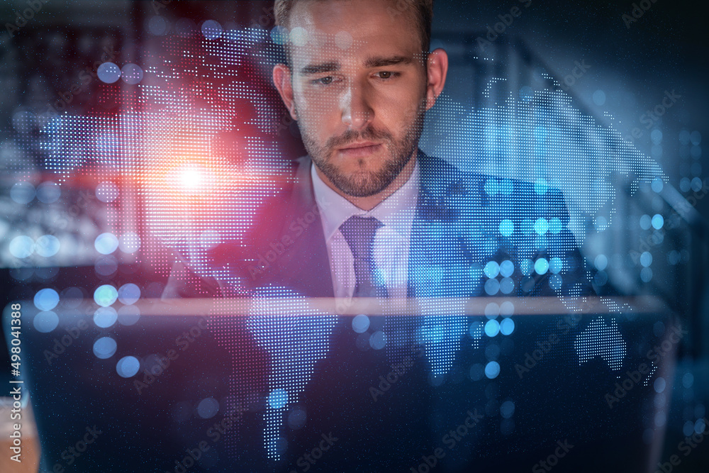 Φωτογραφία Handsome businessman in suit at workplace working with laptop to hire new employees for international business consulting