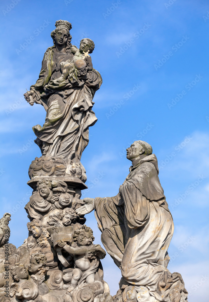 Statues of Madonna and St. Bernard on the Charles bridge in Prague