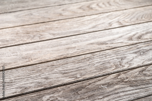 Aged wooden plank floor close-up. Wooden background.