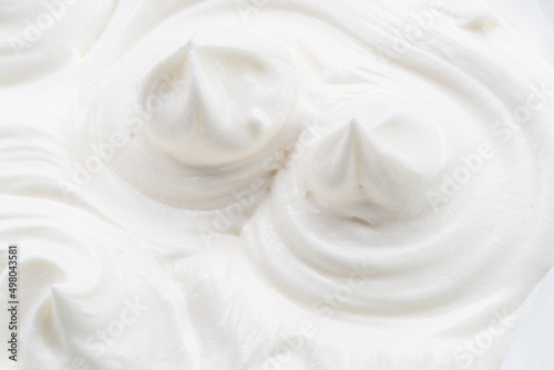 Pics and waves in yoghurt or cream surface. Top view.