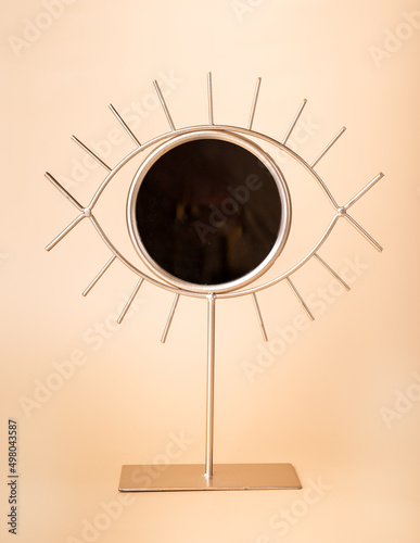 Mirror in eye shape. Modern accessory for home interior and decor in contemporary style. High quality photo