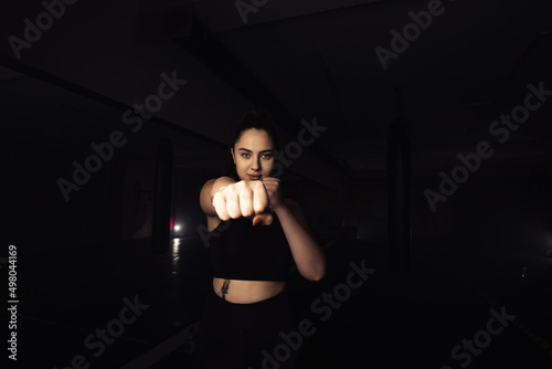 Portrait of a beautiful boxer girl with white hands