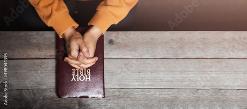 Fotografie, Obraz girl praying thanksgiving with holy scriptures God's teachings based on faith an
