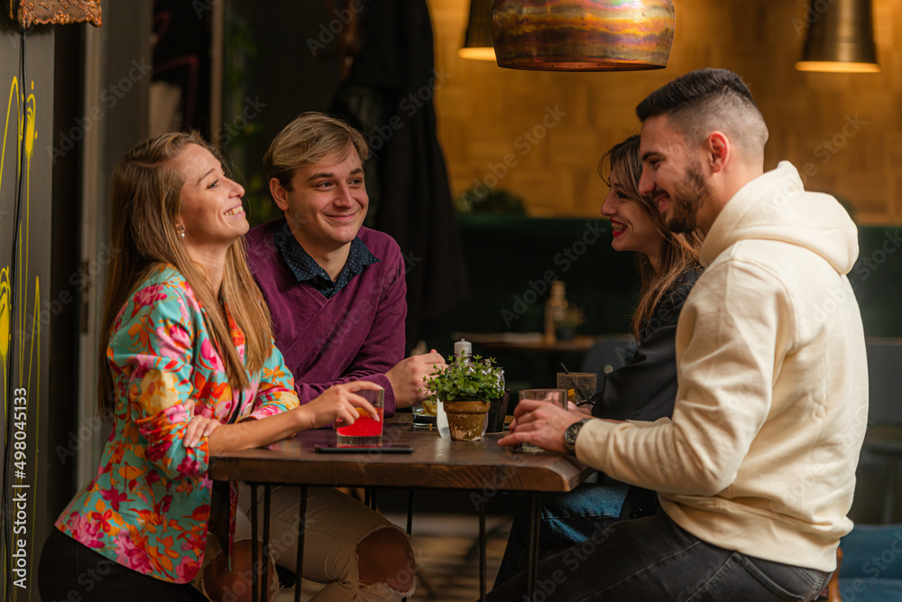 Having a discussion in the bar while having fun together Having a discussion in the bar while having fun together