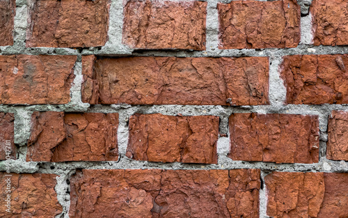 Texture of an old brick wall with plaster
