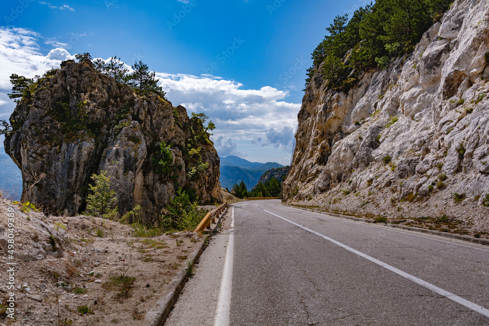 Empty mountain asphalt road in a sunny day at the mountains of Bosnia and Herzegovina
