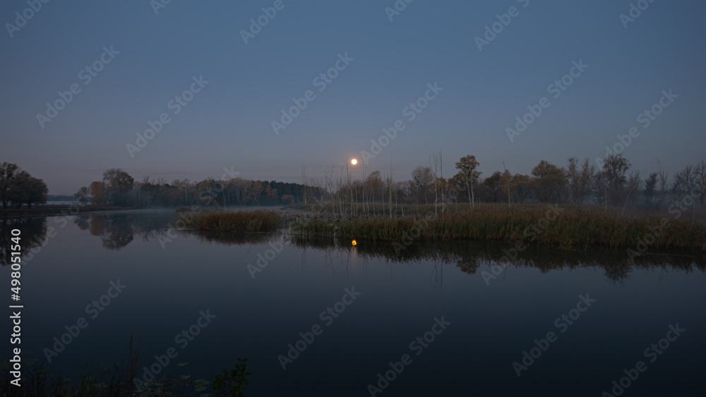 Blurred natural background - river, forest and moon in the early morning. River Psel. Blurred natural background - river, forest and moon in the early morning. River Psel.