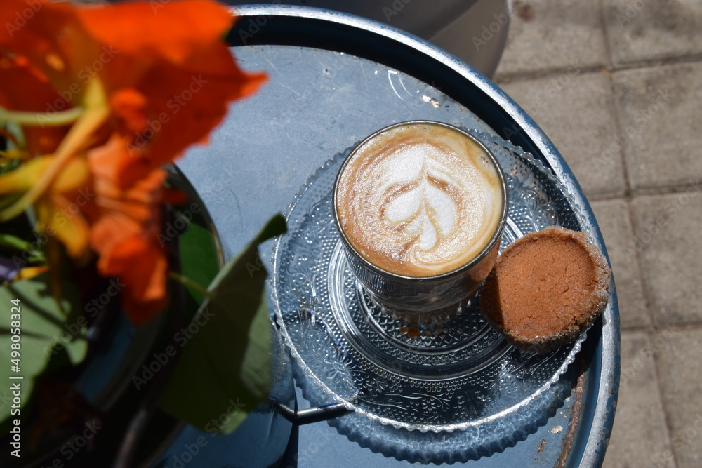 Cappuccino served with a cookie 