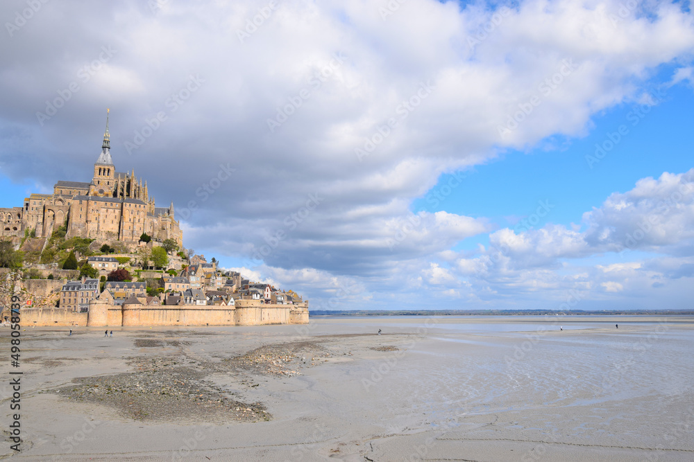 Distant view of Mont St Michel, with dramatic clouds