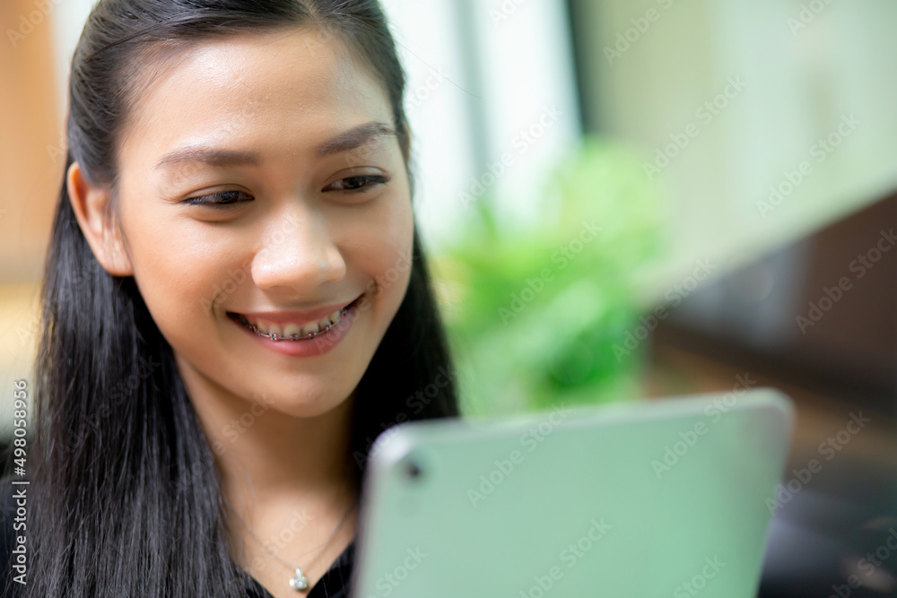 Young asian businesswoman using tablet computer working at office, woman or employee looking tablet with confident, businesspeople working online, one person, business and communication concept. Young asian businesswoman using tablet computer working at office, woman or employee looking tablet with confident, businesspeople working online, one person, business and communication concept.