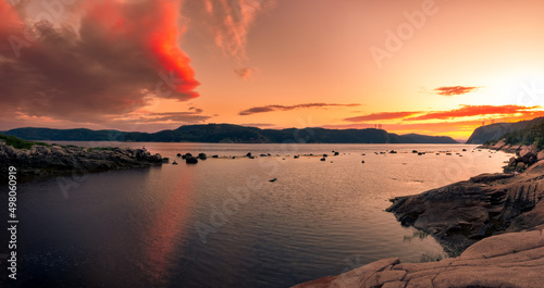 Meditation on the edge of the saguenay fjord at dusk photo