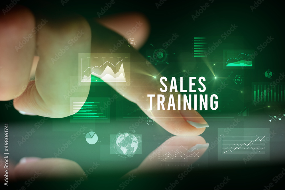 Finger touching tablet with business graphs and icons concept Finger touching tablet with business graphs and icons concept