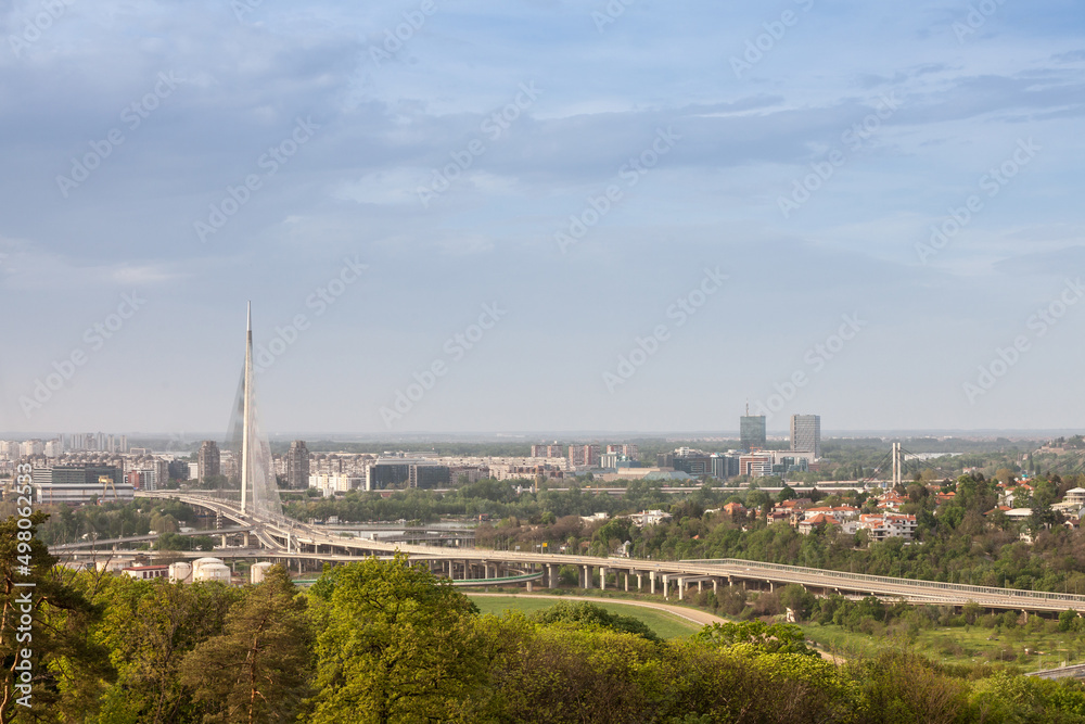 Panorama and skyline of the high rises of Novi Beograd District with the Ada Most bridge with highway streets in front. New Belgrade is the business district of the city.....