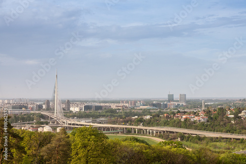 Panorama and skyline of the high rises of Novi Beograd District with the Ada Most bridge with highway streets in front. New Belgrade is the business district of the city.....