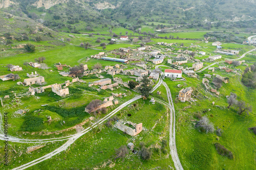 Rural depopulation in Cyprus. Abandoned village Souskiou in Paphos district, aerial landscape photo