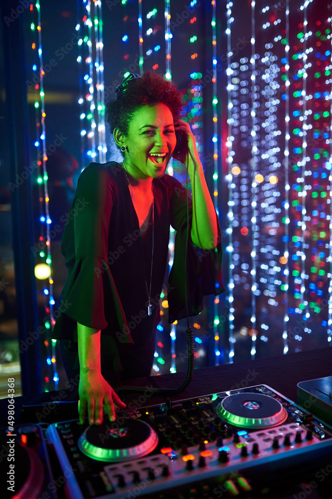 Shes the headline act. Portrait of an attractive young female dj playing in a nightclub. Shes the headline act. Portrait of an attractive young female dj playing in a nightclub.