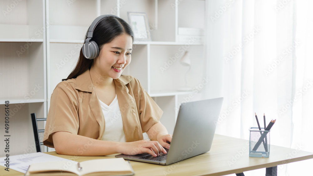 Online lifestyle concept A female staff getting ready to participate in the online meeting with her boss and colleagues. Online lifestyle concept A female staff getting ready to participate in the online meeting with her boss and colleagues.