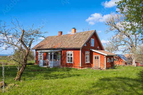 Idyllic red cottage a beautiful spring day