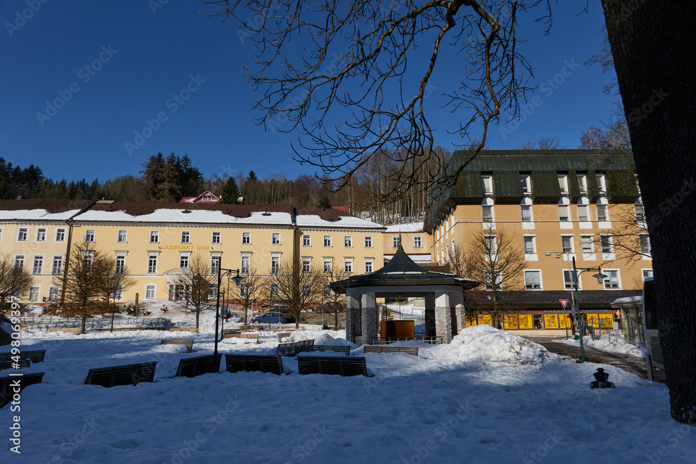 Janske Lazne, Czech Republic - February 13, 2022 - The park in front of the colonnade on a sunny winter day  