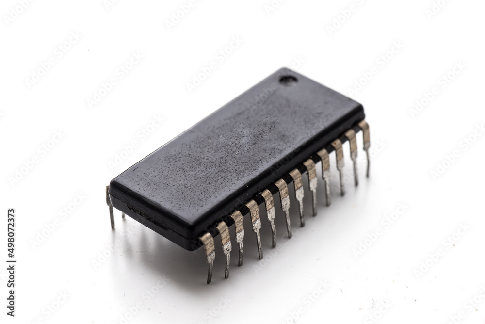 old electronic microcircuit on white background. old electronic microcircuit on white background.