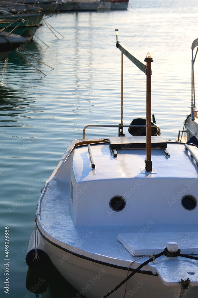 Small fishing boat in the port. Selective focus.