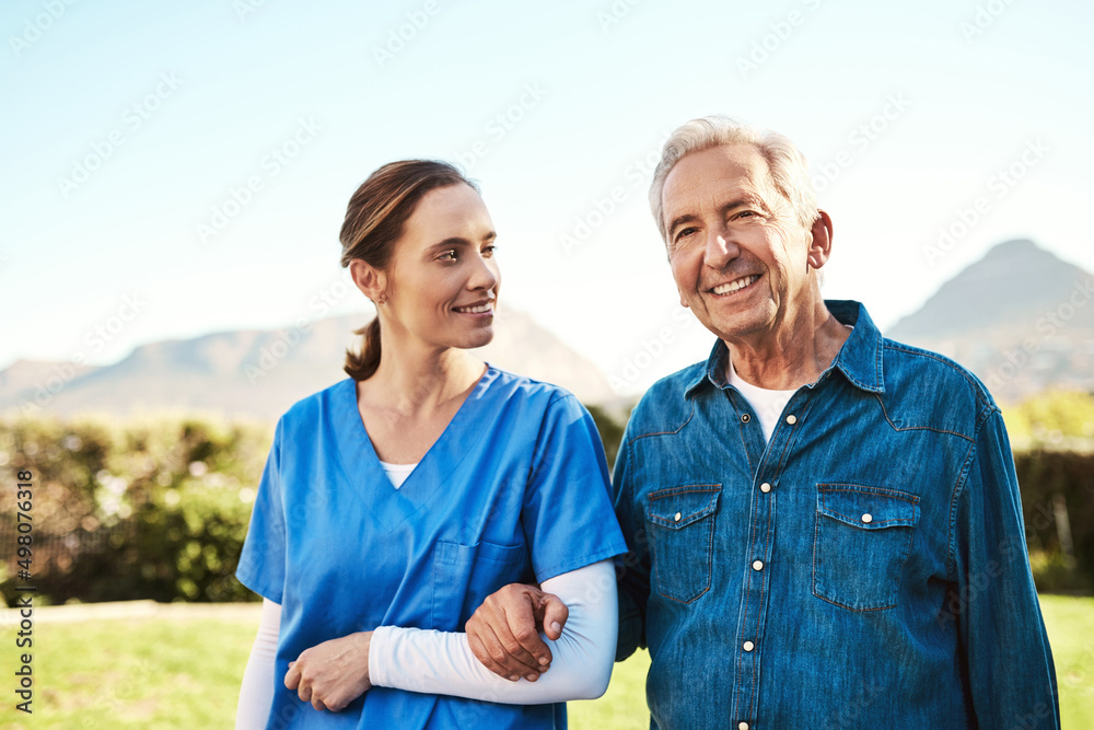 Seeing him happy is my reward. Cropped shot of a young female nurse outside with a senior patient. Seeing him happy is my reward. Cropped shot of a young female nurse outside with a senior patient.
