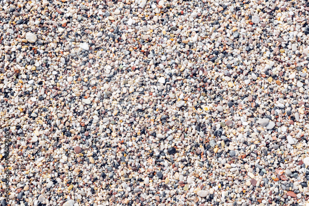 Marine small pebbles background, texture of sea sand, close-up. Marine small pebbles background, texture of sea sand, close-up.
