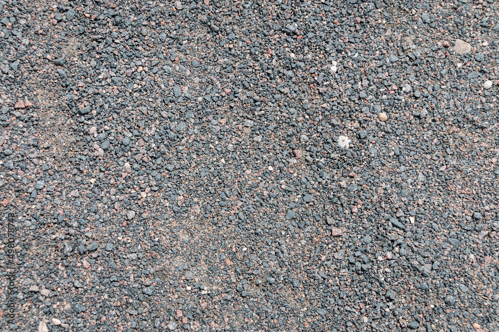 Texture of dark gray asphalt with small stones. Texture. Background.