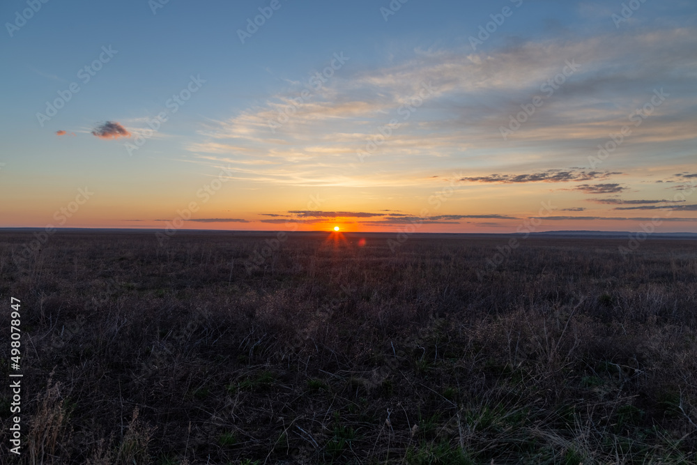 Sunset in the Burtinskaya steppe (Orenburg nature reserve). Orenburg region, Southern Urals, Russia.