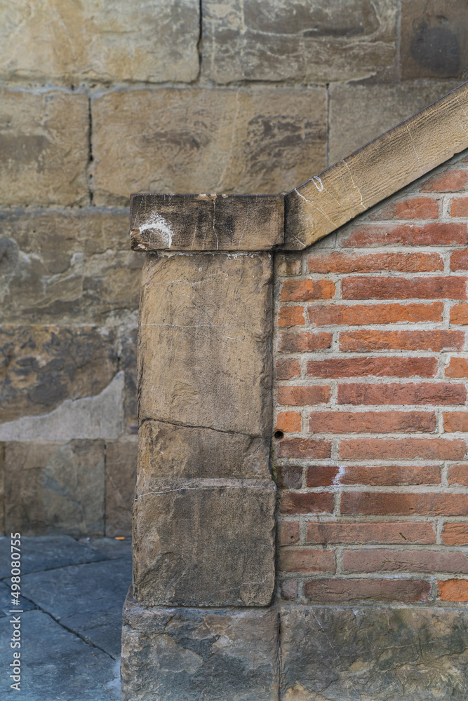 detail of an old medieval staircase and brick wall in Florence, Italy 