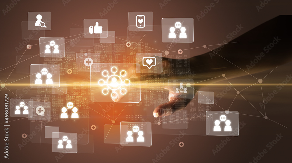 Hand pressing social media multimedia application screen with media icons on futuristic concept Hand pressing social media multimedia application screen with media icons on futuristic concept