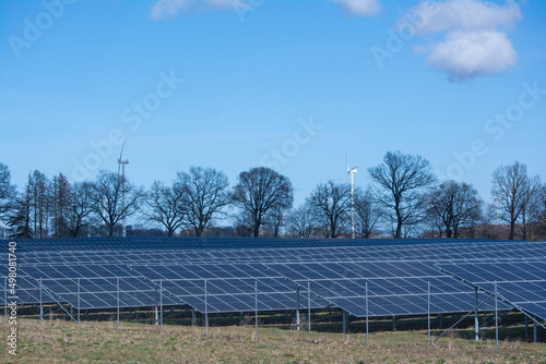 Solar panels on a field on a sunny day in spring