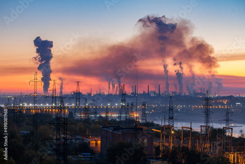 Quadro su tela Industrial landscape of plant pipes producing toxic smoke with air pollution in