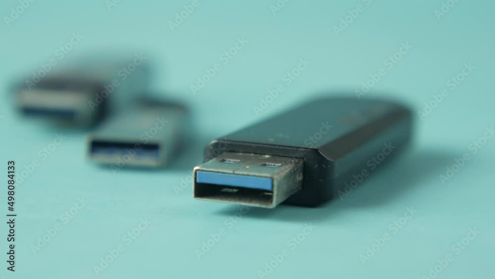 USB flash drive on blue background close up USB flash drive on blue background close up