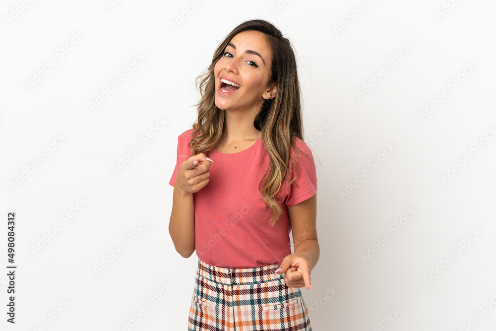Young woman over isolated background surprised and pointing front Young woman over isolated background surprised and pointing front