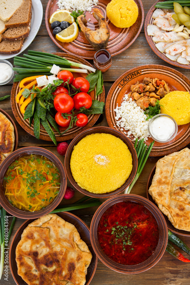 Homemade Romanian Food with
pies, polenta, borscht, vegetables, fish, meat, stew, cheese and wine. Traditional dishes from Romania and the Republic of Moldova. Homemade Romanian Food with
pies, polenta, borscht, vegetables, fish, meat, stew, cheese and wine. Traditional dishes from Romania and the Republic of Moldova.