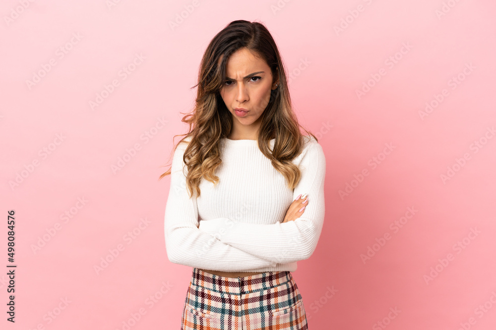 Young woman over isolated background with unhappy expression Young woman over isolated background with unhappy expression