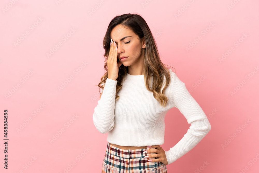 Young woman over isolated background with headache Young woman over isolated background with headache