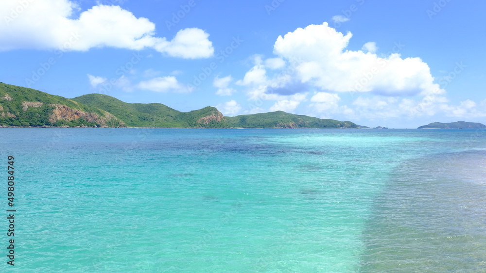 Beautiful tropical beach with white sand and clear water at Kho Kham Island, Chonburi Province, Thailand.