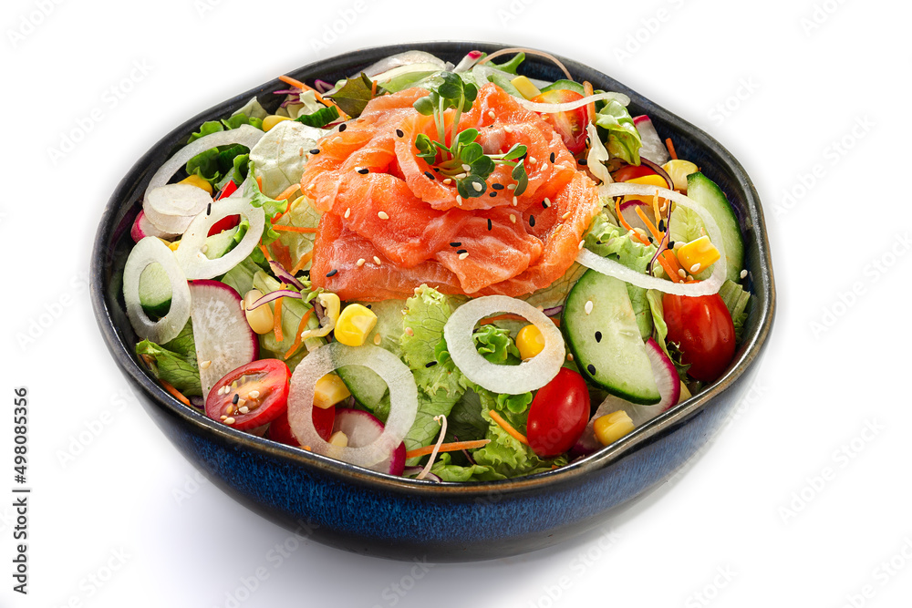 Fresh salmon sashimi salad with cherry tomatoes, cucumbers and lettuce greens isolated on a white background
