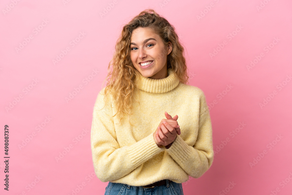 Young blonde woman isolated on pink background laughing Young blonde woman isolated on pink background laughing
