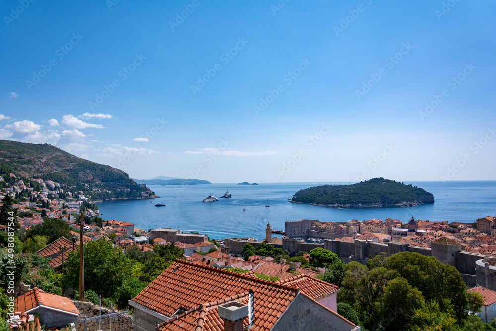 View of the old town of Dubrovnik from up hill in a sunny summer day